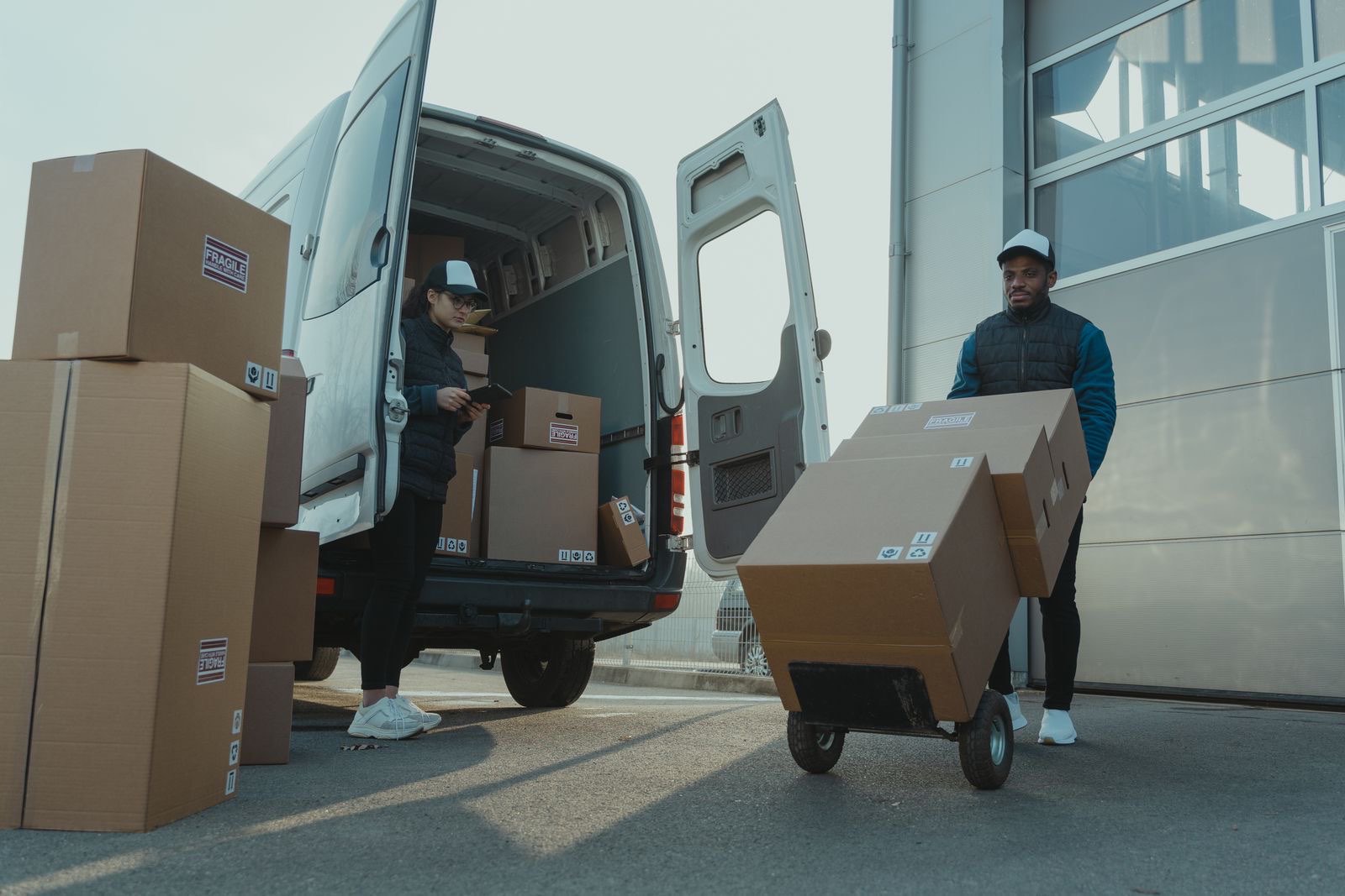Workers loading parcels for outbound delivery