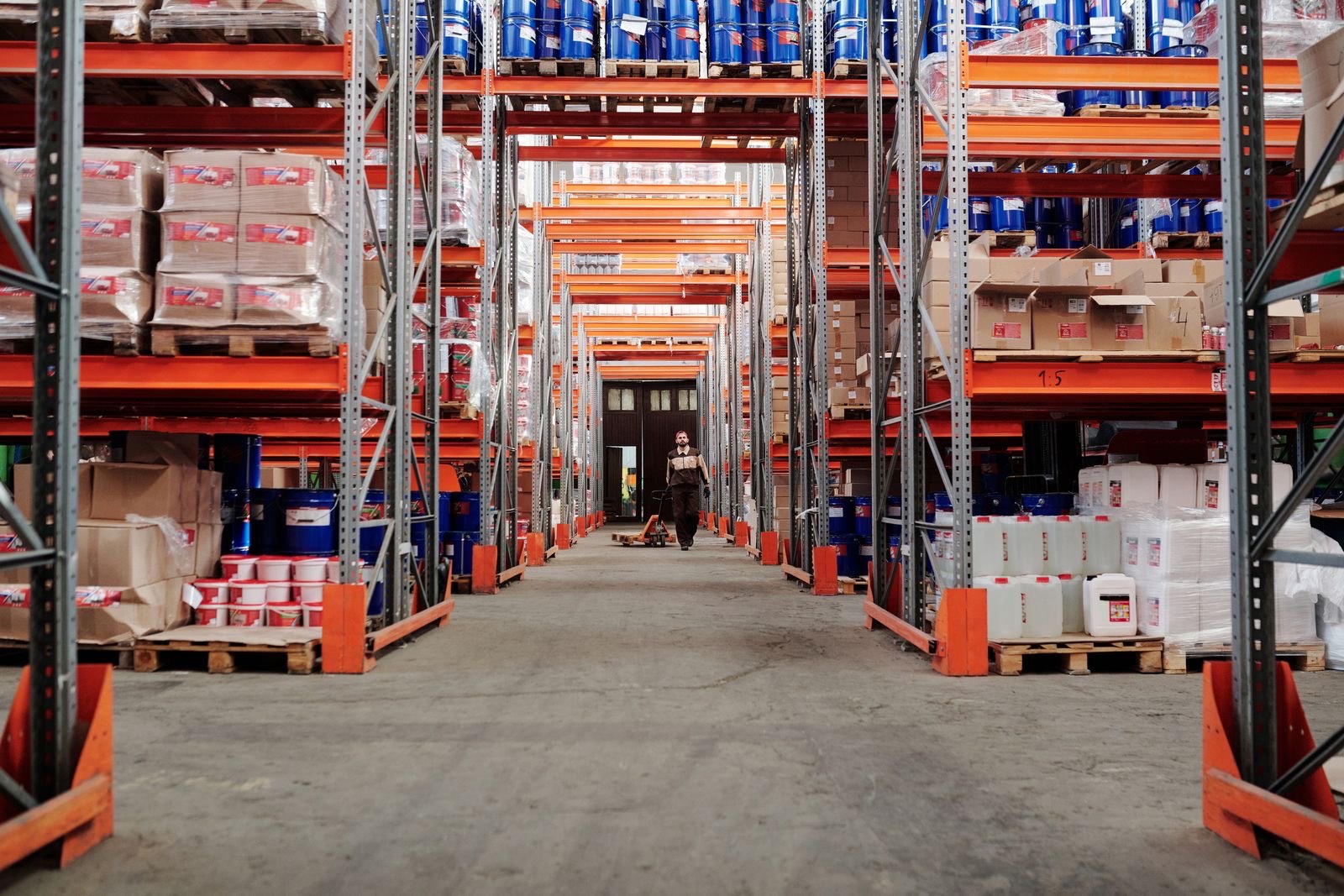 Drums and chemicals stored on warehouse racking