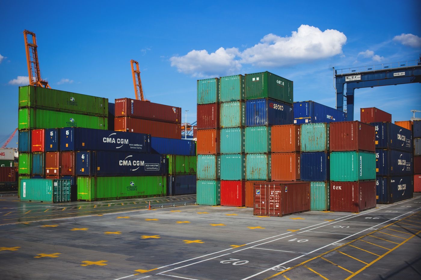 Shipping containers stacked at a port terminal yard