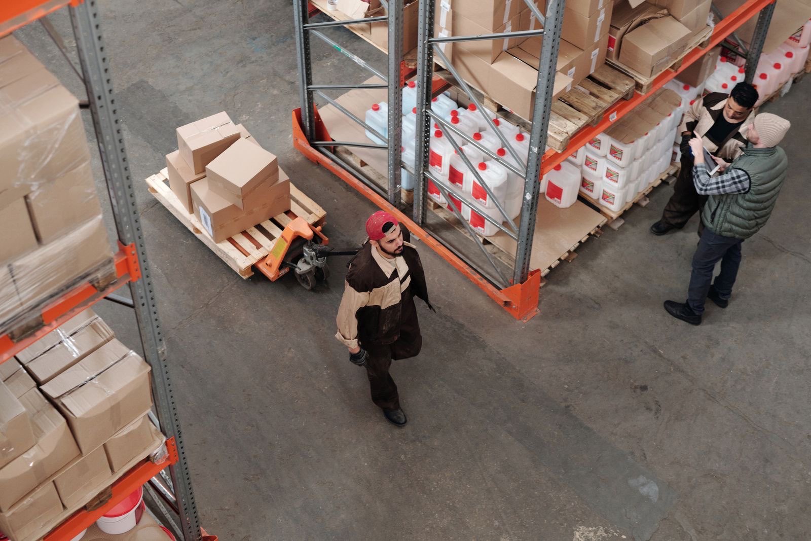 Warehouse crew moving palletized freight